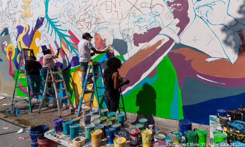 paint and artists in front of bowery graffiti wall