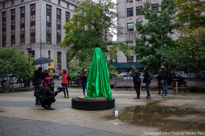 Photo of Medusa Sculpture covered by green cloth