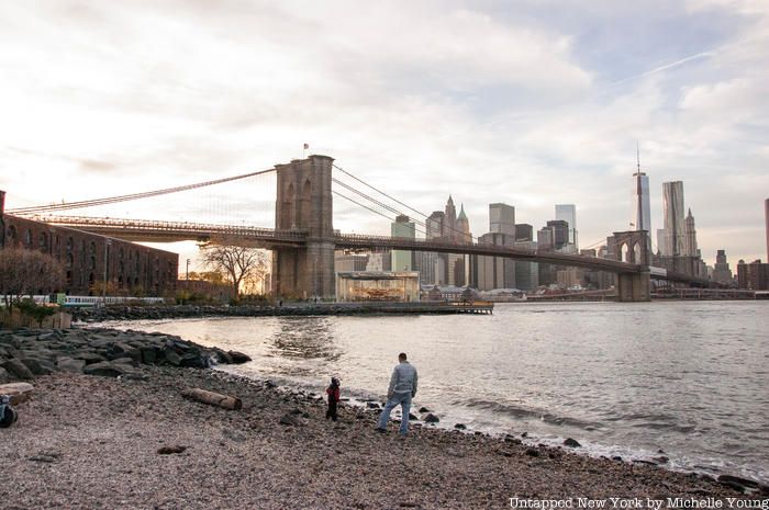 A view of the Brooklyn Bridge and NYC skyline from Pebble Beach