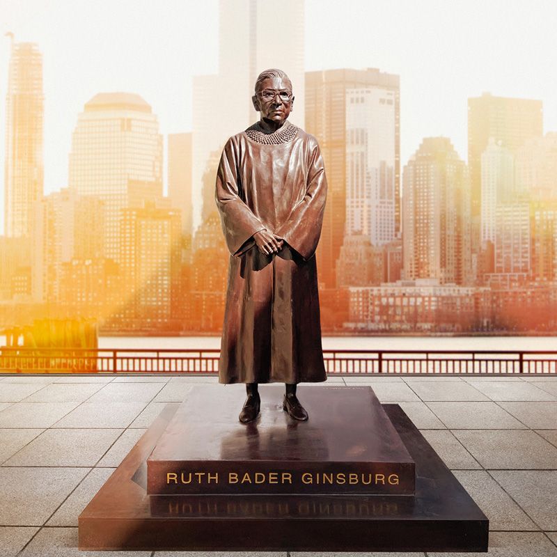 Ruth Bader Ginsburg statue with skyline in background