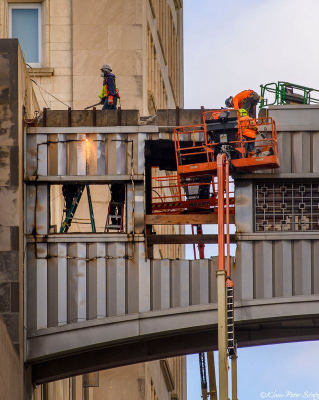 workers on MetLife Building sky bridge