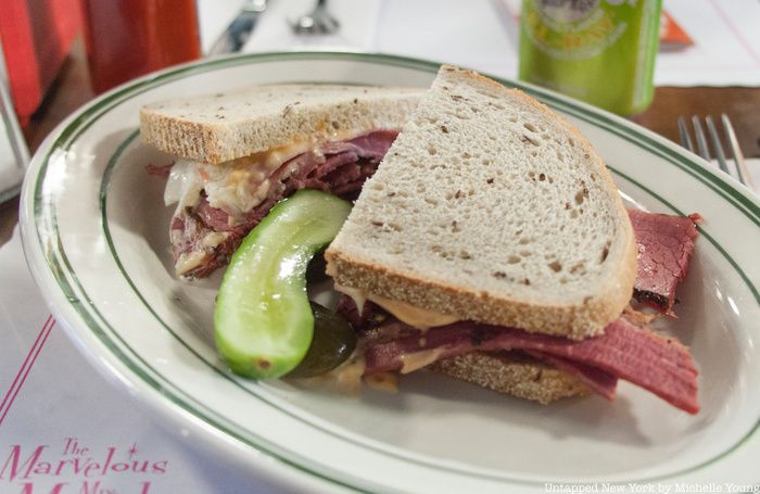 A pickle and deli sandwhich