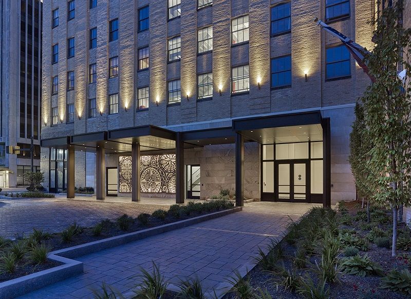 new public entrance and entry plaza with vehicle drop-off,