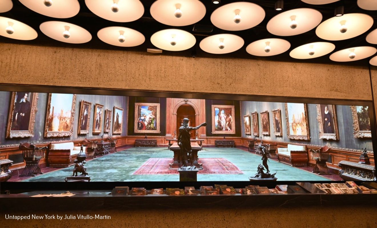 The entrance to Frick Madison, below the famous Breuer ceiling, presents a loop of digital images, many of the original Frick Mansion.