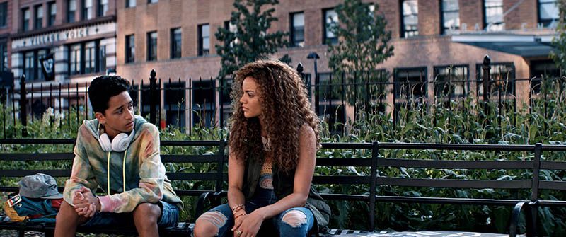 Gregory Diaz IV as Sonny and Leslie Grace as Nina Rosario sit in Cooper Triangle in In the Heights