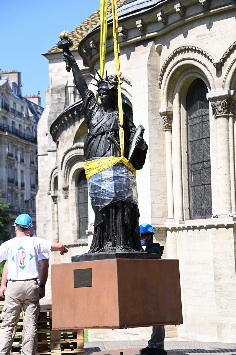 Statue of Liberty hoisted up 