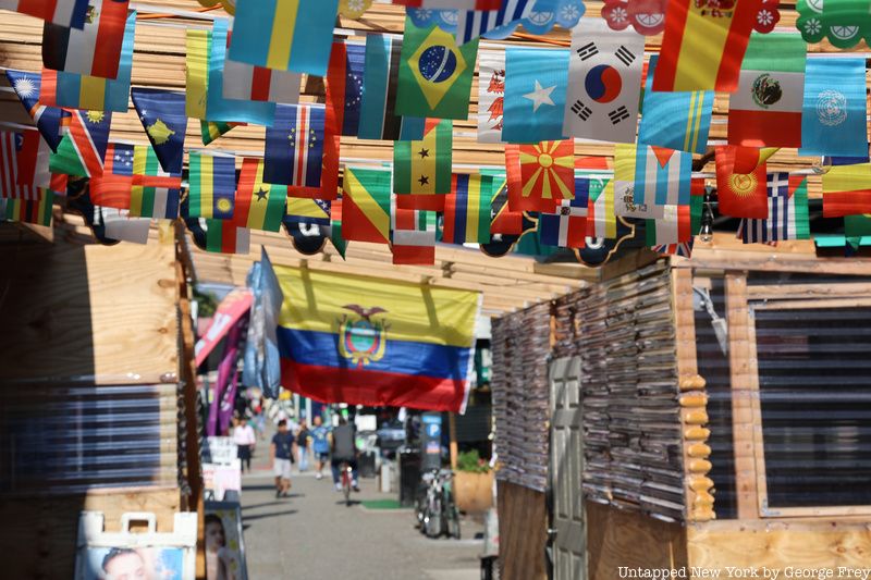 Jackson Heights flags on sidewalk