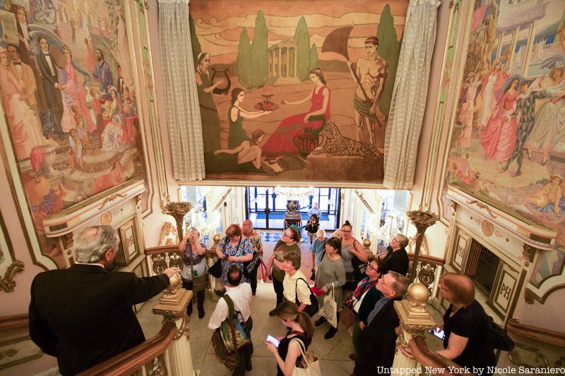 Tour group below stair at Grand Prospect Hall