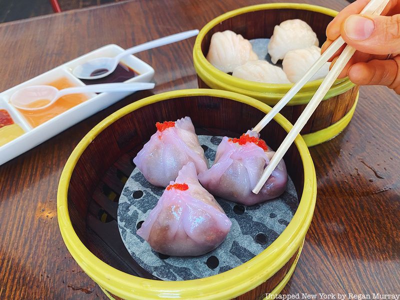 An order of three Peking duck and asparagus dumplings and four har gow dumplings from Jing Fong