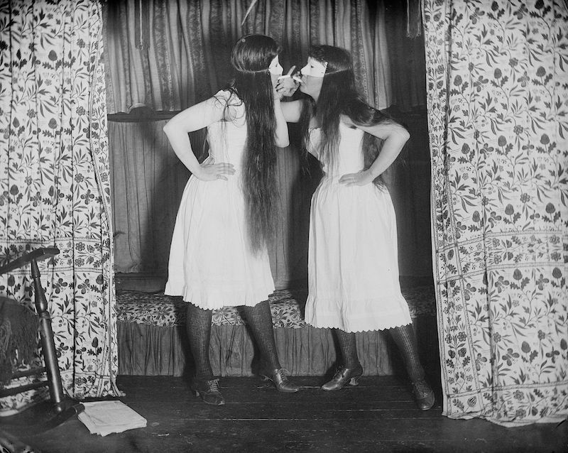 two women in bloomers and masks