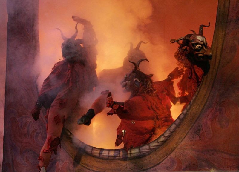 Creatures emerge from fog onto a stage during "The Grand Procession of the Ghouls" at the Halloween Extravaganza and Procession of Ghouls in 2006. Photo by Stan Honda. Courtesy of the Cathedral of St. John the Divine.