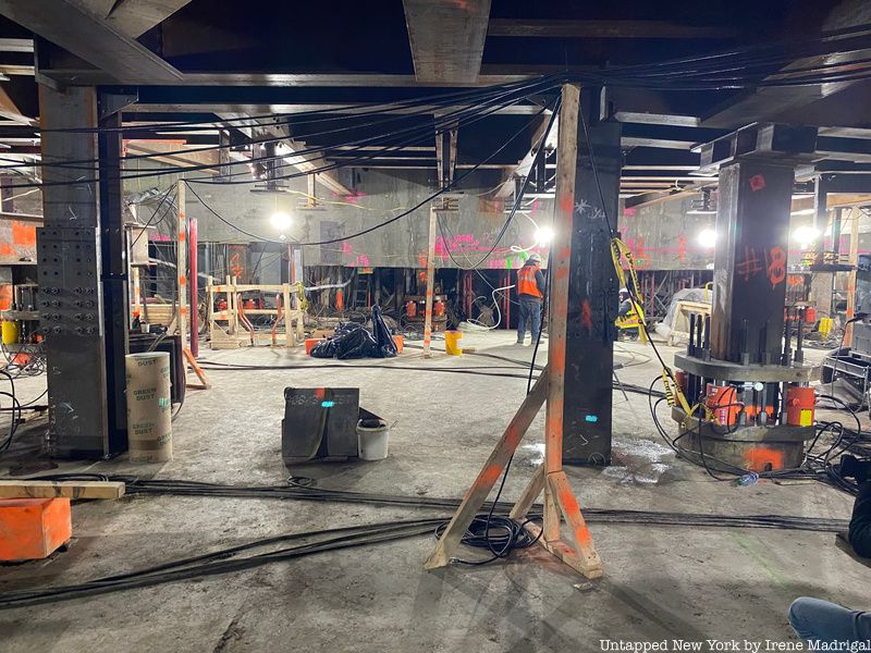 Underground construction work in preparation for the lifting of the Palace Theatre featuring the hydraulic jacks utilized to help lift the structure off the ground.