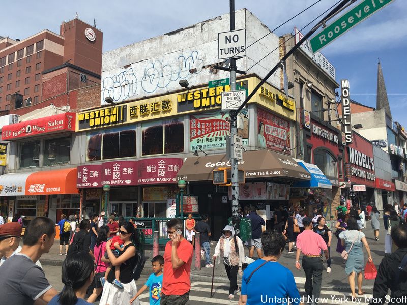 Busy intersection of Roosevelt Avenue and Main Street in Flushing