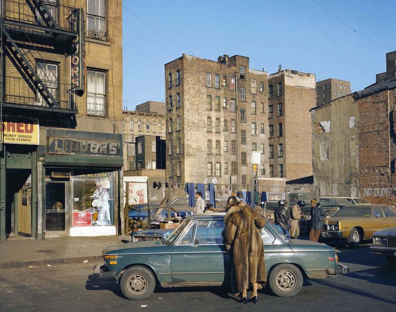 a woman in front of a car in the Lower East Side 1980