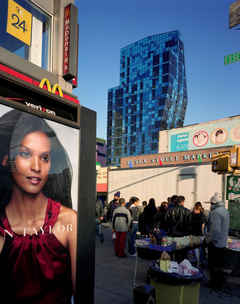 a billboard and skyscraper in the Lower East Side