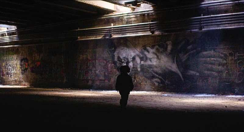 Chris Pape mural of holding hands inside Freedom Tunnel