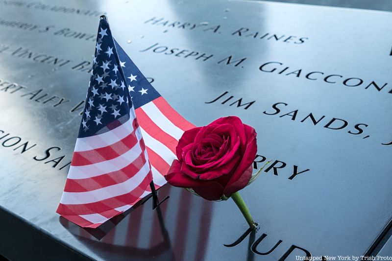 rose and flag at the 9/11 memorial