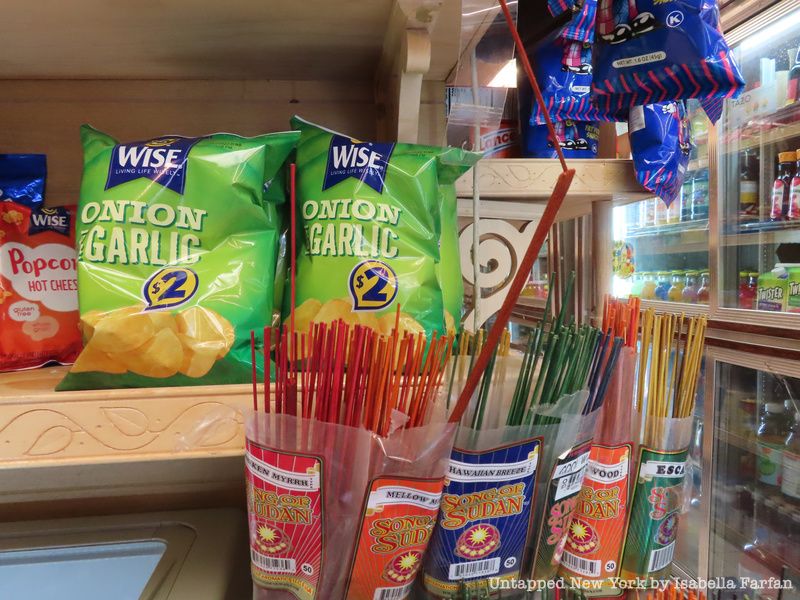 Incense and snacks inside a bodega.