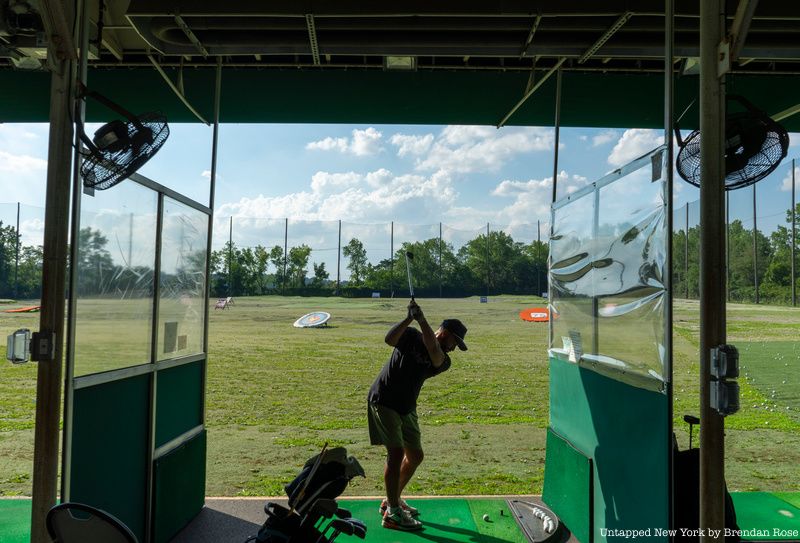 A man golfing at the golf course that stands at the site of Kiddy City.