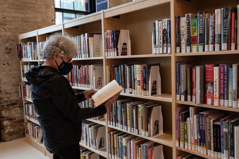 A woman reads a book at Brooklyn Public Library