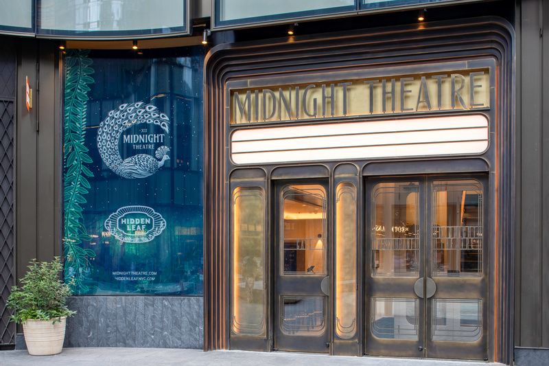 The entrance to Midnight Theatre features an art deco marquee