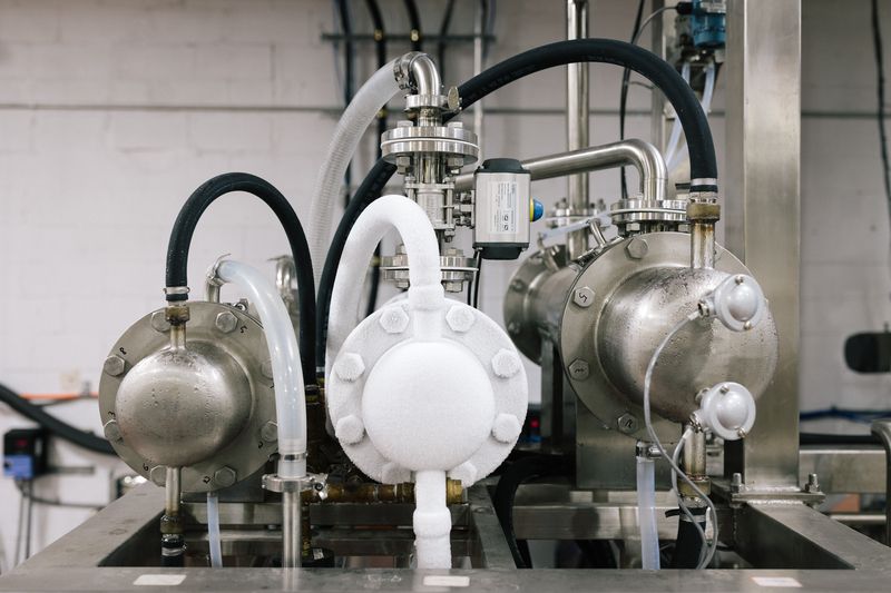 Metal barrels and tubes at Arcane Distillery