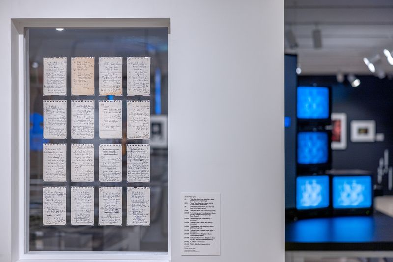 Pages of lyrics in a display case at NYPL, written by Lou Reed of unreleased Velvet Underground songs