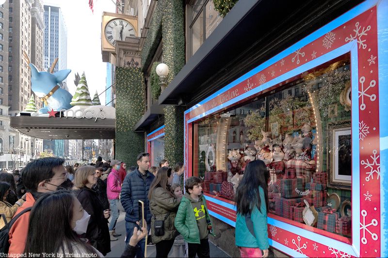 Onlookers check out Macy's holiday display