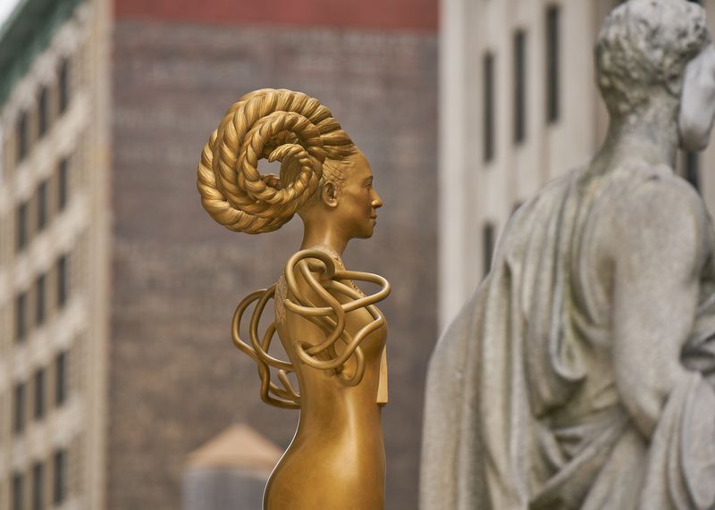 golden sculpture NOW on top of NYC courthouse