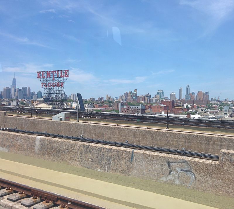 Kentile floor sign against NYC skyline