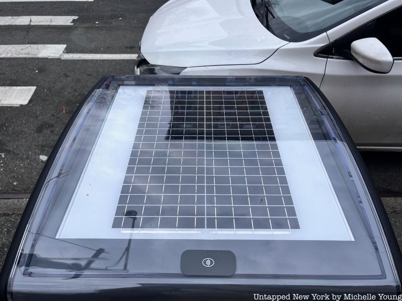 Solar panel on top of the orange smart compost bins in NYC