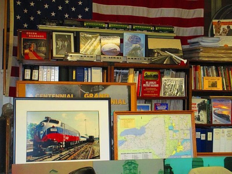 Shelves of books, posters, and pictures inside the Williamson Library at Grand Central Terminal