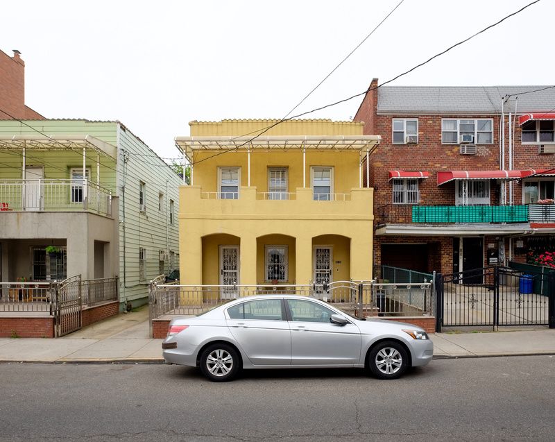 A yellow house in Elmhurst Queens