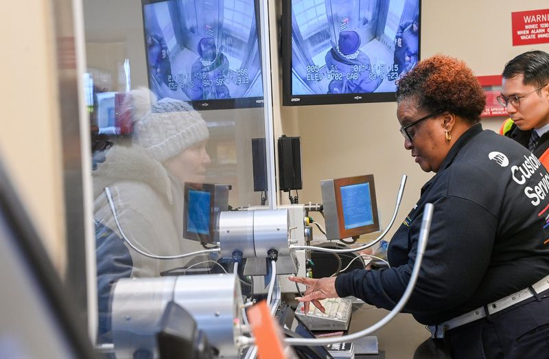 An MTA worker at the window of new MTA Customer Service Center at the Coney Island subway station