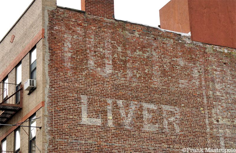 A faded ghost sign in East Harlem reads, "Liver." It once advertised Tutt's Liver Pills, a patent medicine.