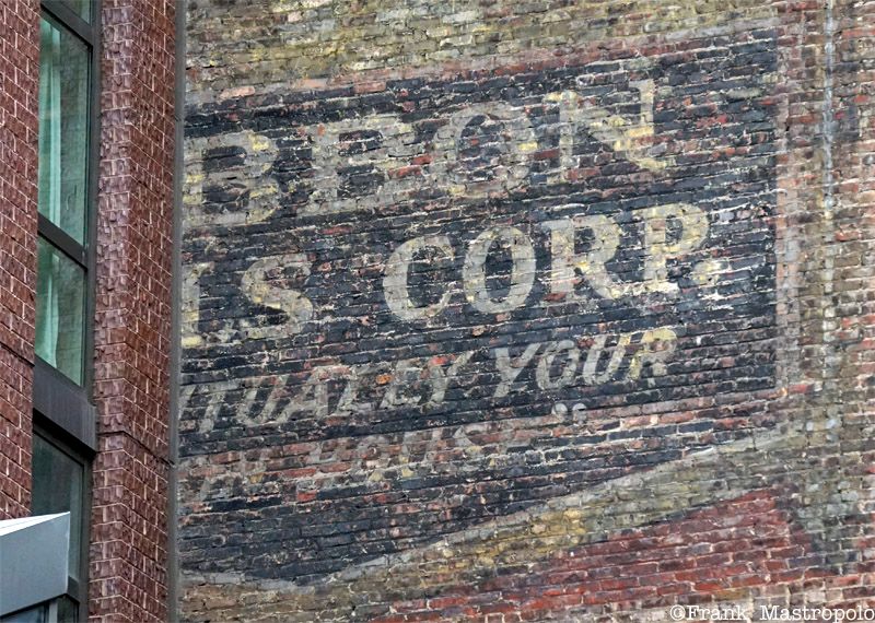 Ribbon Mills Corp. ghost sign in NoMad is puzzling because a new building covers some of it.