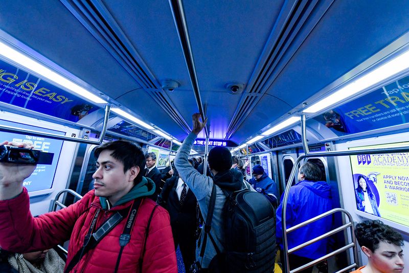 Passengers aboard the new subway cars