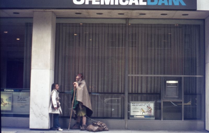 Moondog standing next to a woman on the street