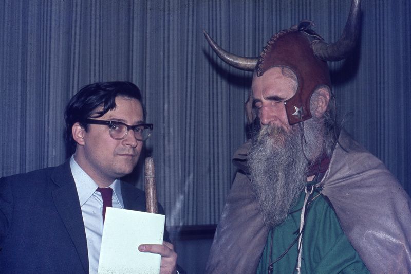 Moondog standing next to another man