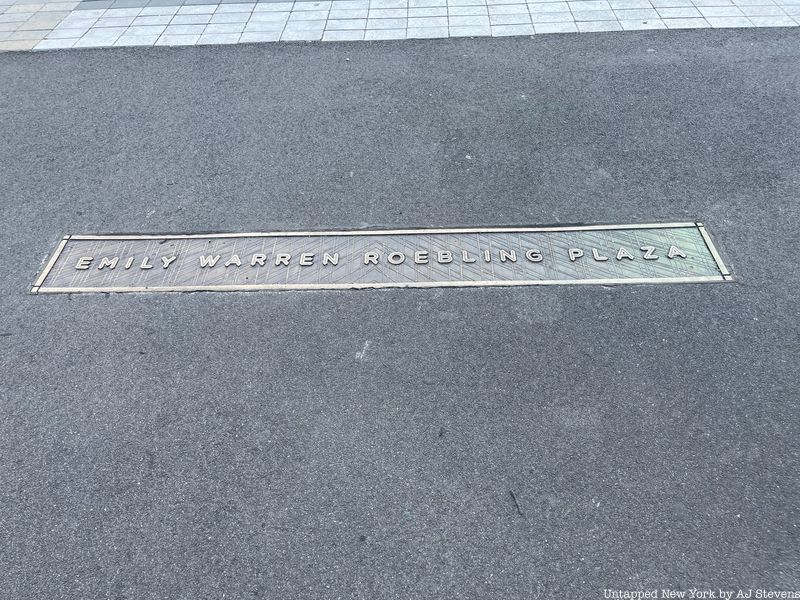 Sidewalk plaque that reads Emily Roebling Plaza