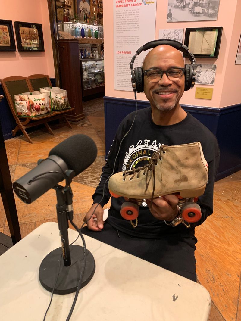 Eric Alston holding a roller skate