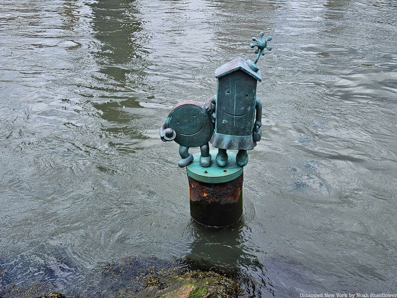 Tom Otterness sculpture in the East River just off Roosevelt Island