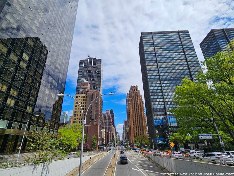 Overhead view of a street and tall glass buildings in Turtle Bay