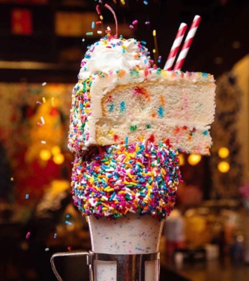 Black Tap Burgers milkshake with a slice of cake on top