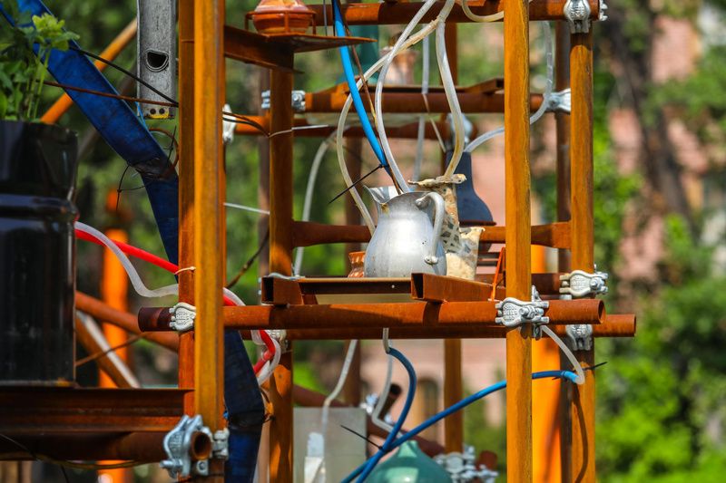 The water clock by Mattingly features buckets and tubes that carry water from the East River into the installation. 