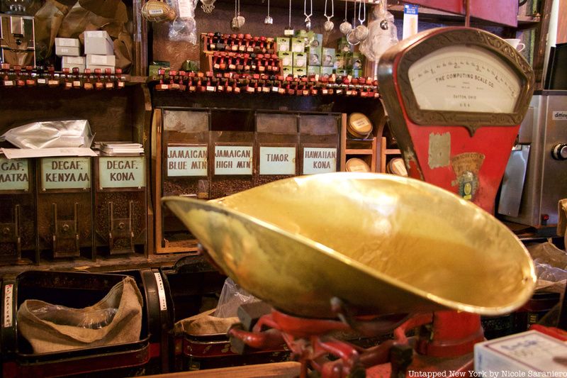 Coffee scale and coffee beans in containers inside McNulty's