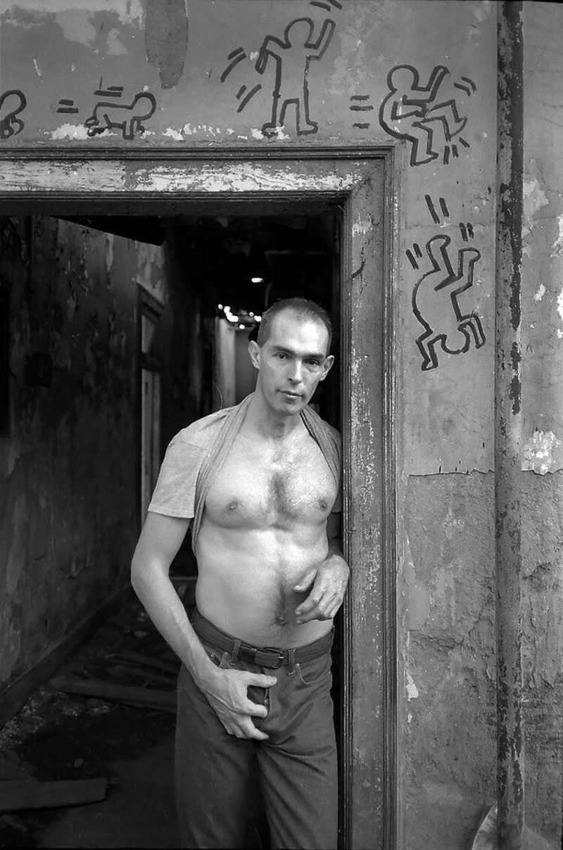 Stanely Stellar's photograph, "Peter at the Door." Image shows a man in a door frame with Keith-Harring-esque drawings.