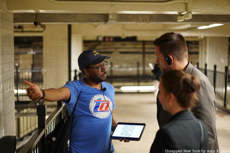 Tour guide with group in the NYC subway