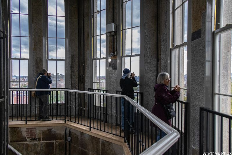 People taking photographs out the window of High Bridge Water Tower