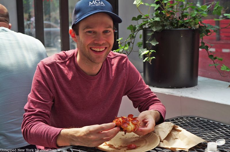 New york food tour guest eating pizza